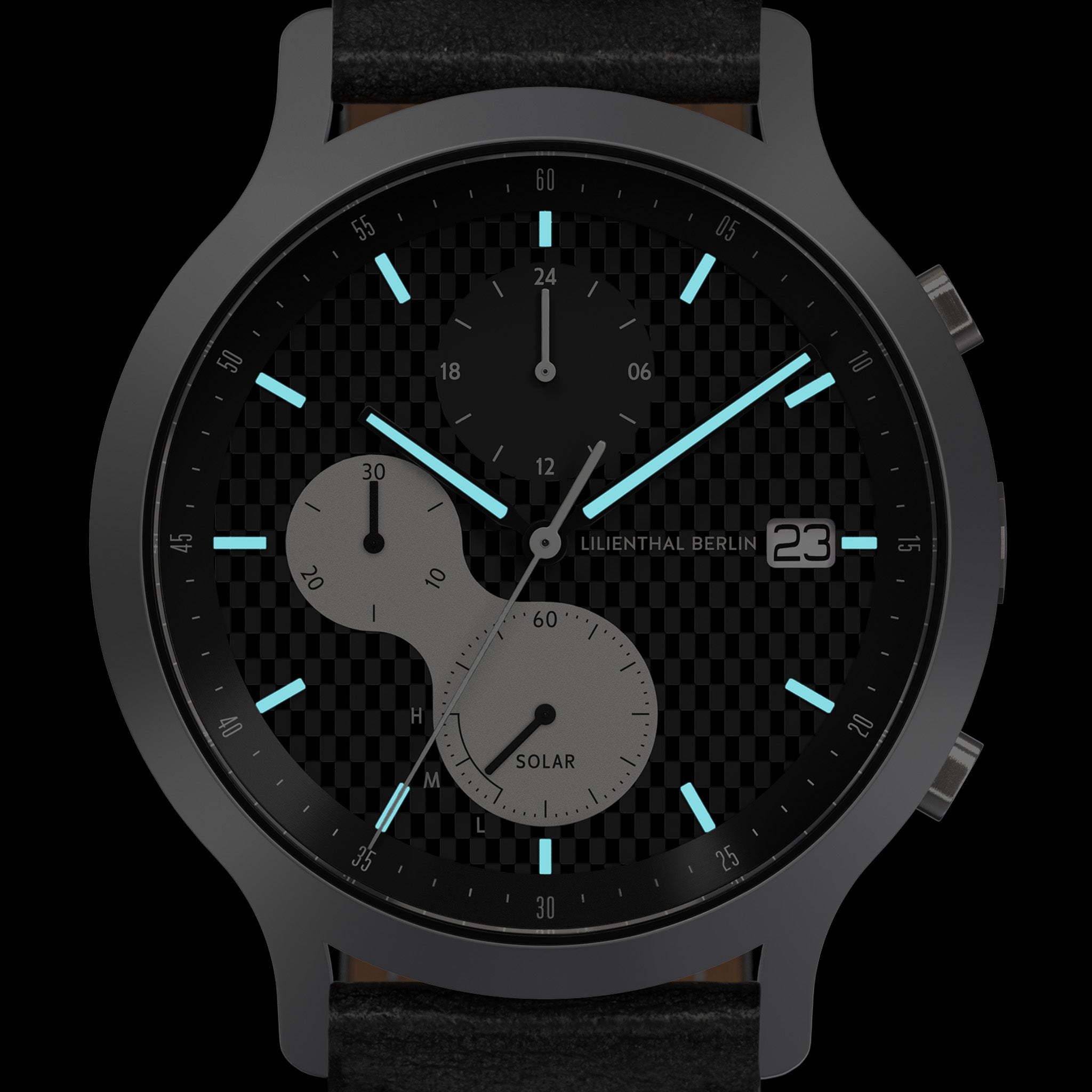 Black solar-powered analog watch with subdials on a textured face and luminous blue markers