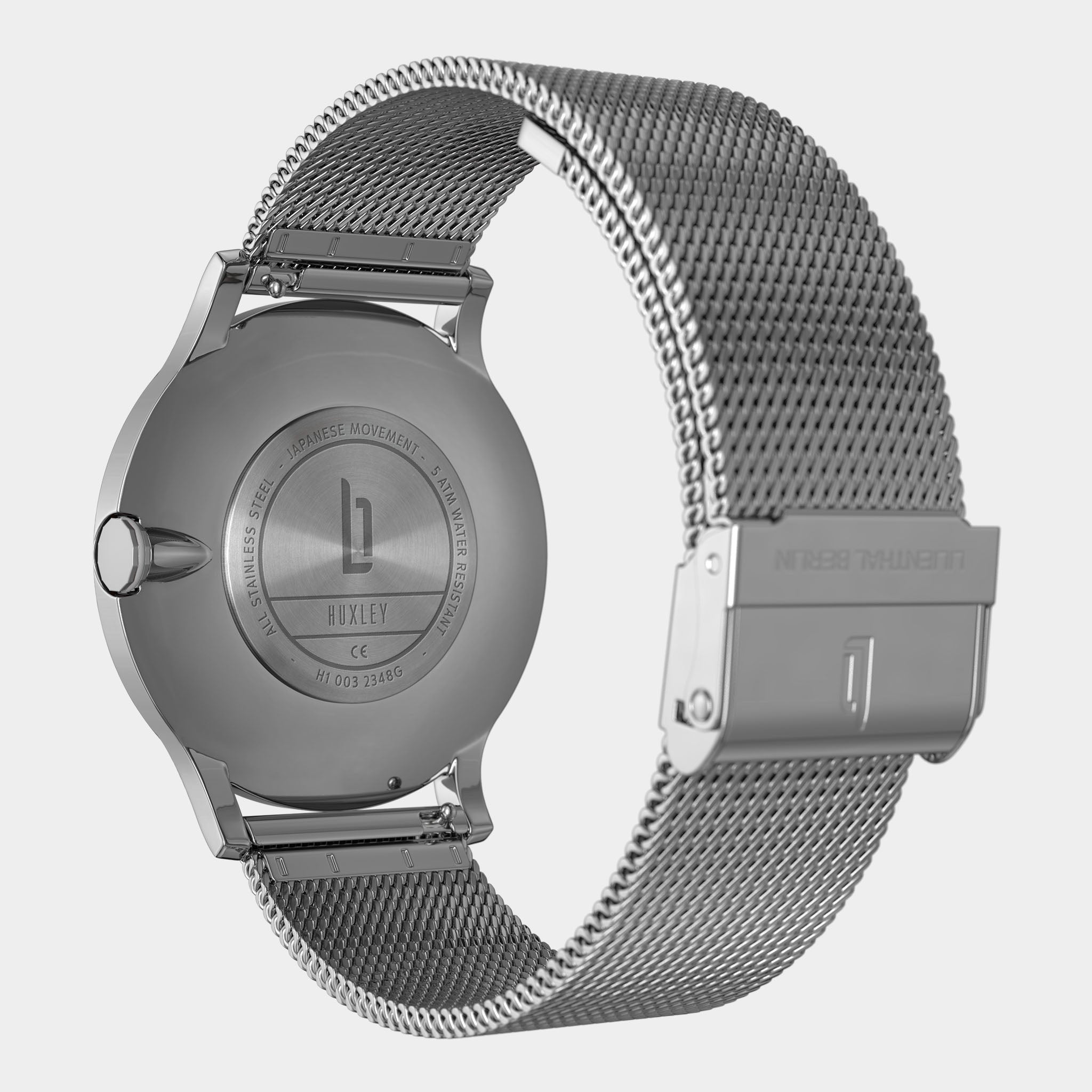 Stainless steel mesh watch strap and engraved caseback with Japanese movement details