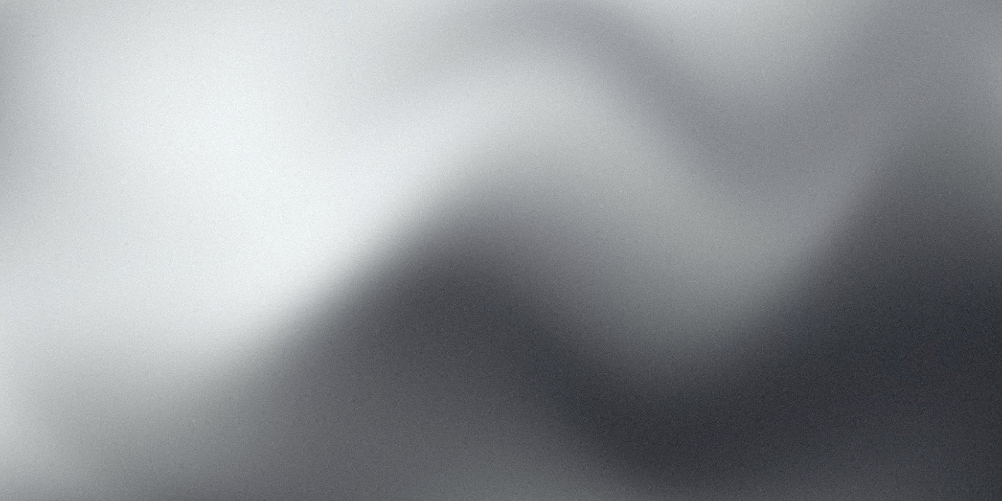 Minimalist grey gradient background with soft abstract transitions