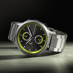 Stainless steel chronograph watch with black dial, yellow accents, and date display