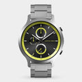 Stainless steel chronograph watch with black dial, yellow accents, and date display