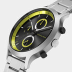 Modern chronograph wristwatch with black dial, yellow accents, and stainless steel band