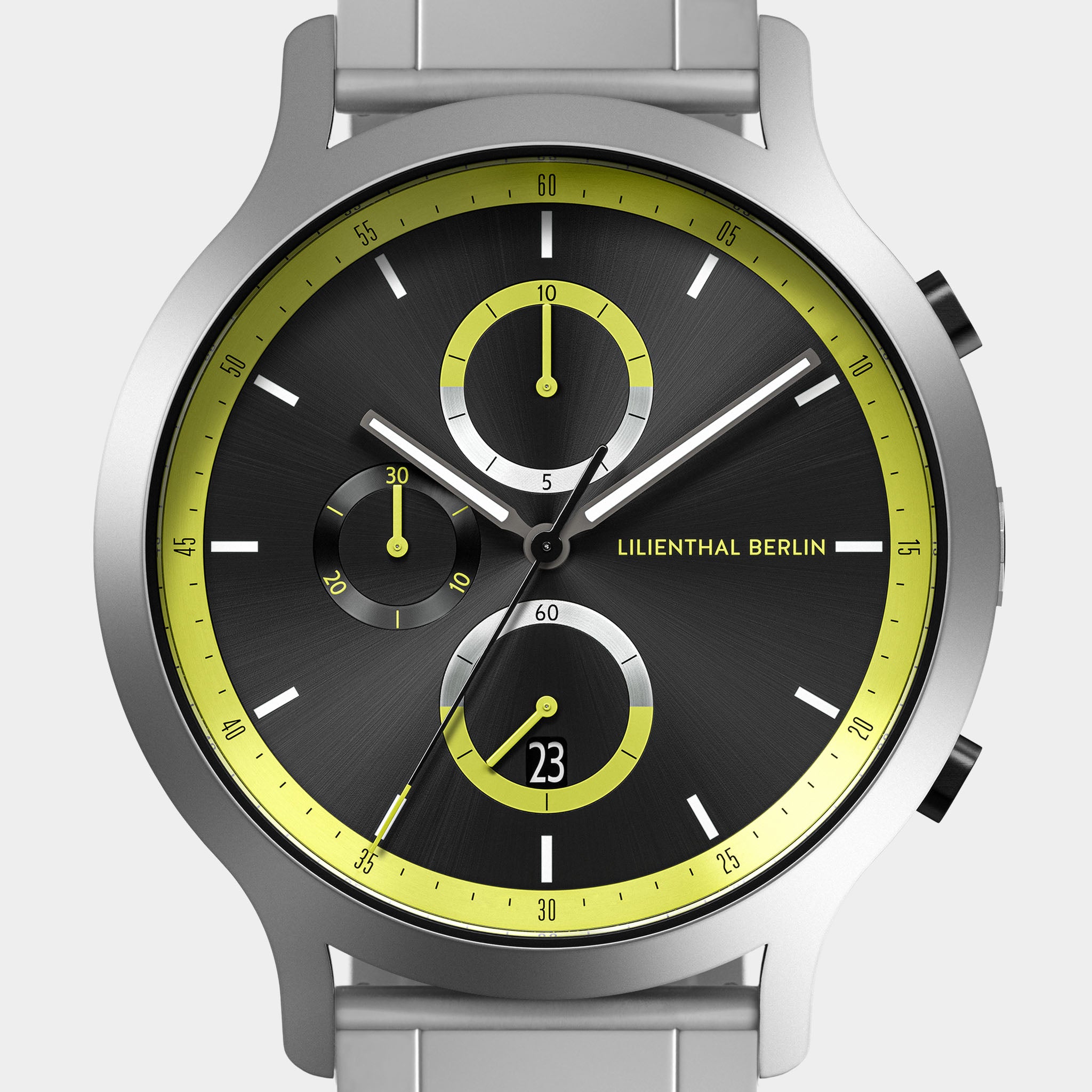 Modern chronograph watch with black dial, yellow accents, subdials, and silver case