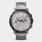Stainless steel chronograph watch with grey dial, red tachymeter bezel, and date display.