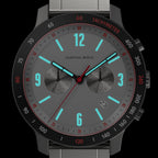 Modern chronograph watch with gray dial, luminous blue markers, and tachymeter bezel.