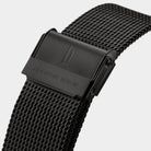 Black stainless steel mesh watch strap with engraved clasp, modern design